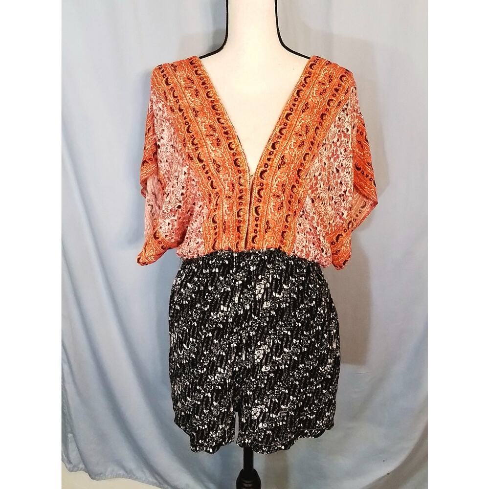 Free People, orange and black drop shoulder romper